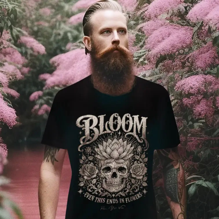 Man wearing Bloom T-Shirt (short sleeved) outdoors among pink blossoms, shirt in Black.