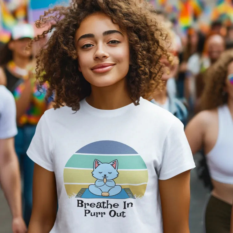 Woman wearing White Breathe In T-Shirt with playful yoga cat design and mindful retro artwork.