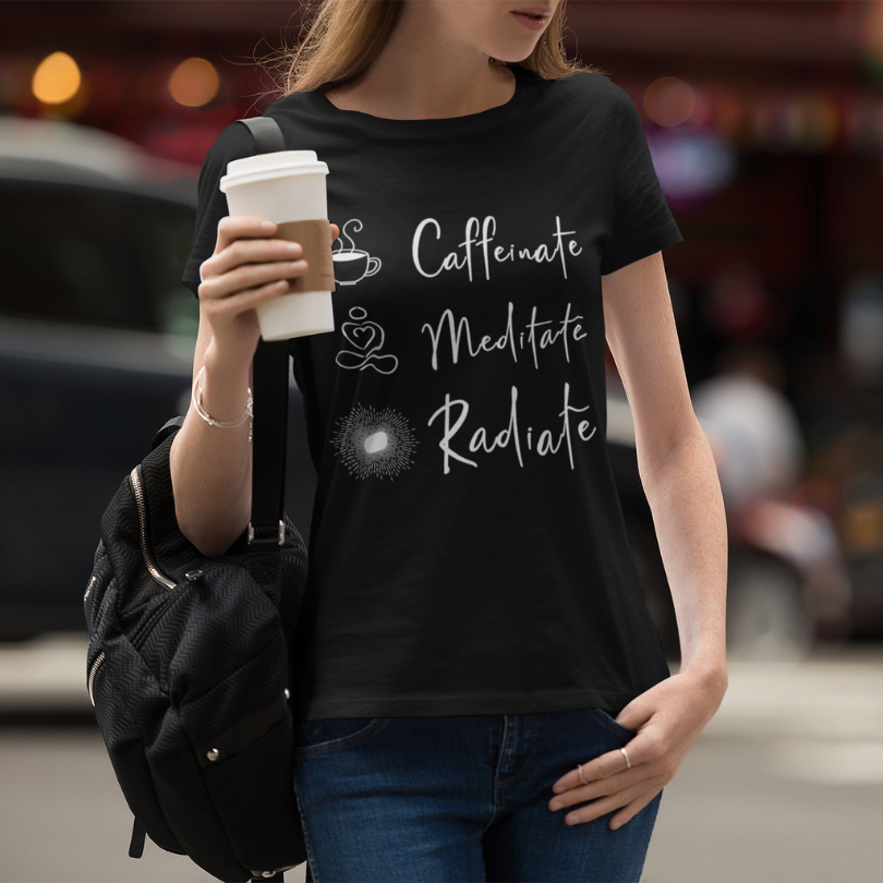 Woman wearing Caffeinate Black T-Shirt outdoors, holding a coffee cup — The Vault collection by Ramro Yoga Wear