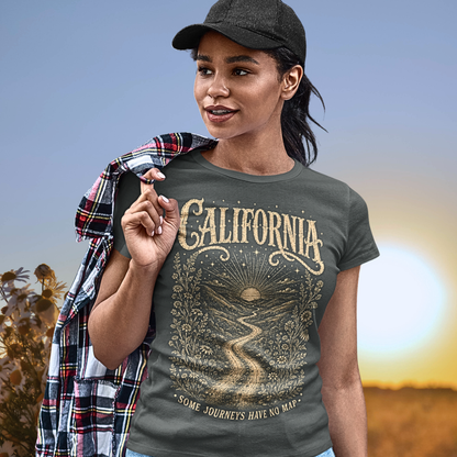 Person wearing a short sleeved tee called California in Dark Heather Grey. A sacred yoga shirt at golden hour in an open field — Sacred Thread collection by Ramro Yoga Wear