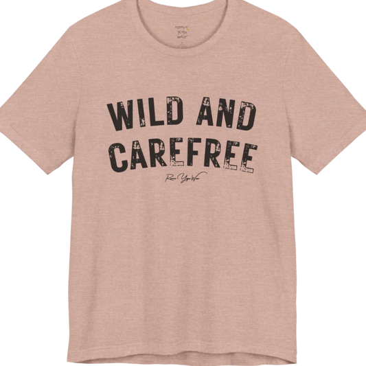 Bold typography reading "Wild And Carefree" — Funny Yoga Shirts collection by Ramro Yoga Wear in Heather Prism Peach