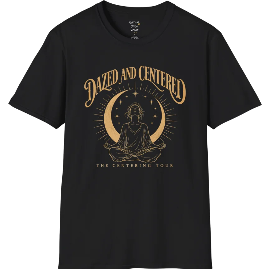 A short sleeved tee called the Centered T-Shirt, flat lay and a soft cotton shirt. Simply says, Dazed and Centered, The Centering Tour. Design highlights a person meditating in lotus pose beneath a gold crescent moon with radiating rays and a ring of small stars. Color is Black.