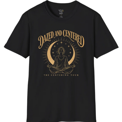 A short sleeved tee called the Centered T-Shirt, flat lay and a soft cotton shirt. Simply says, Dazed and Centered, The Centering Tour. Design highlights a person meditating in lotus pose beneath a gold crescent moon with radiating rays and a ring of small stars. Color is Black.