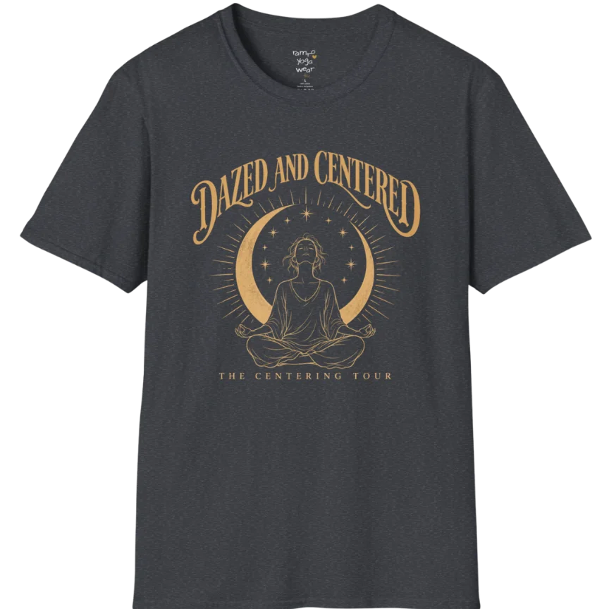 A short sleeved tee called the Centered T-Shirt, flat lay and a soft cotton shirt. Simply says, Dazed and Centered, The Centering Tour. Design highlights a person meditating in lotus pose beneath a gold crescent moon with radiating rays and a ring of small stars. Color is Dark Heather Grey.