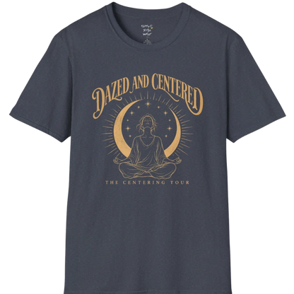 A short sleeved tee called the Centered T-Shirt, flat lay and a soft cotton shirt. Simply says, Dazed and Centered, The Centering Tour. Design highlights a person meditating in lotus pose beneath a gold crescent moon with radiating rays and a ring of small stars. Color is Heather Navy.