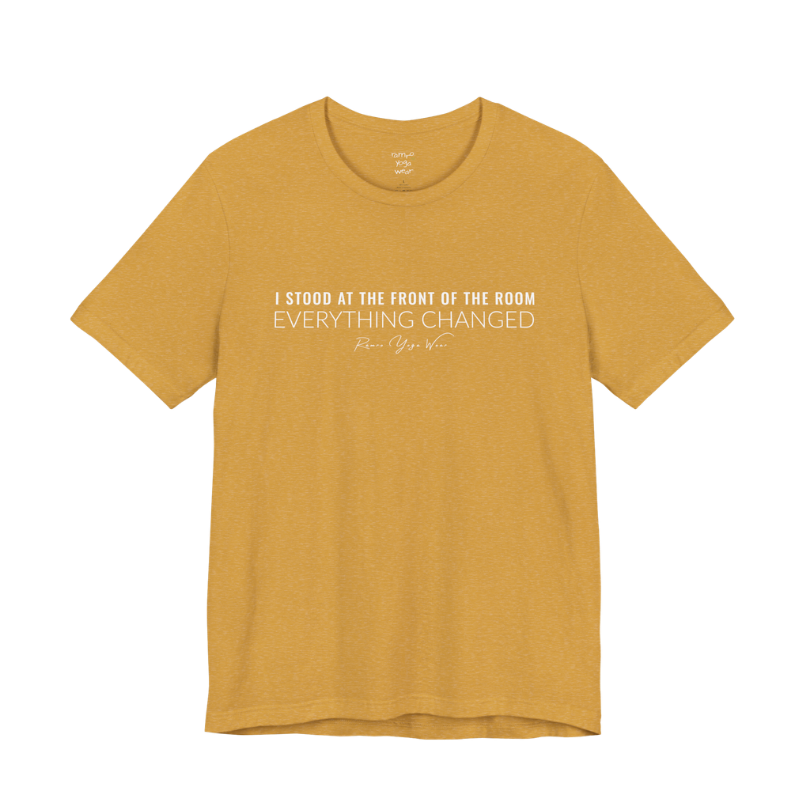 I STOOD AT THE FRONT OF THE ROOM EVERYTHING CHANGED yoga teacher gift tee flat lay in Heather Mustard — Yoga Teacher Gifts collection by Ramro Yoga Wear