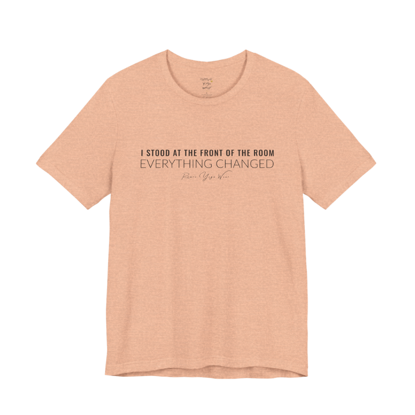 I STOOD AT THE FRONT OF THE ROOM EVERYTHING CHANGED yoga teacher gift tee flat lay in Heather Peach — Yoga Teacher Gifts collection by Ramro Yoga Wear