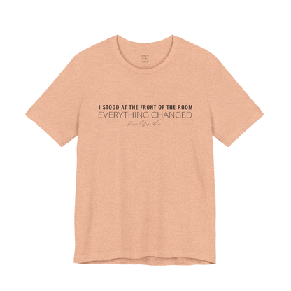 I STOOD AT THE FRONT OF THE ROOM EVERYTHING CHANGED yoga teacher gift tee flat lay in Heather Peach — Yoga Teacher Gifts collection by Ramro Yoga Wear