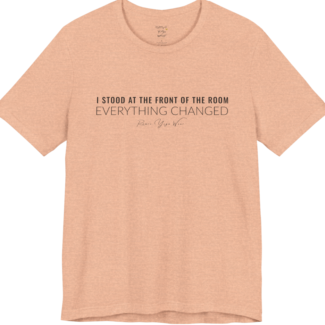 I STOOD AT THE FRONT OF THE ROOM EVERYTHING CHANGED yoga teacher gift tee flat lay in Heather Peach — Yoga Teacher Gifts collection by Ramro Yoga Wear