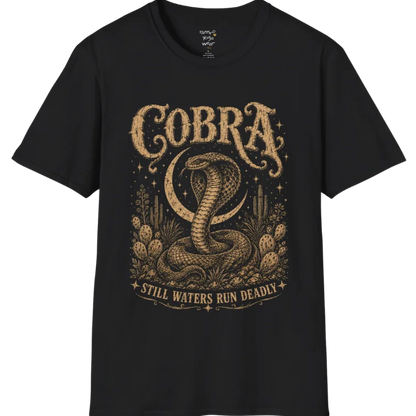 A grunge tee with an illustrated cobra design, hood flared, botanical linework framing the scene, text reading "Cobra" and "Still Waters Run Deadly" — Wild Animals collection by Ramro Yoga Wear in Black.