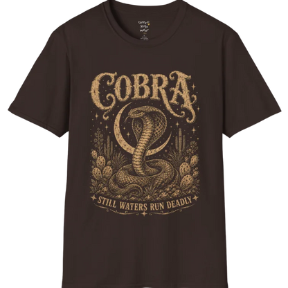 A grunge tee with an illustrated cobra design, hood flared, botanical linework framing the scene, text reading "Cobra" and "Still Waters Run Deadly" — Wild Animals collection by Ramro Yoga Wear in Dark Chocolate.