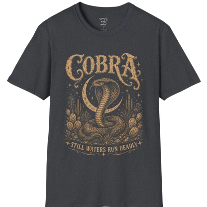 A grunge tee with an illustrated cobra design, hood flared, botanical linework framing the scene, text reading "Cobra" and "Still Waters Run Deadly" — Wild Animals collection by Ramro Yoga Wear in Dark Heather Grey.