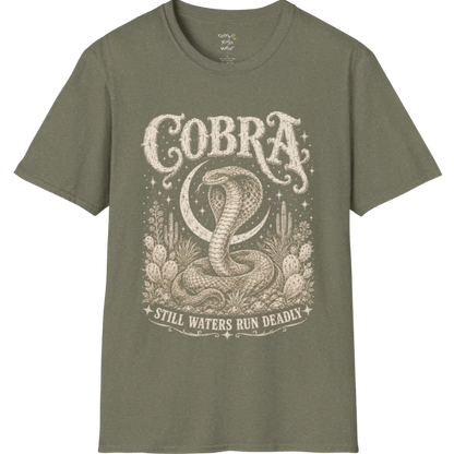 A grunge tee with an illustrated cobra design, hood flared, botanical linework framing the scene, text reading "Cobra" and "Still Waters Run Deadly" — Wild Animals collection by Ramro Yoga Wear in Heather Military Green.