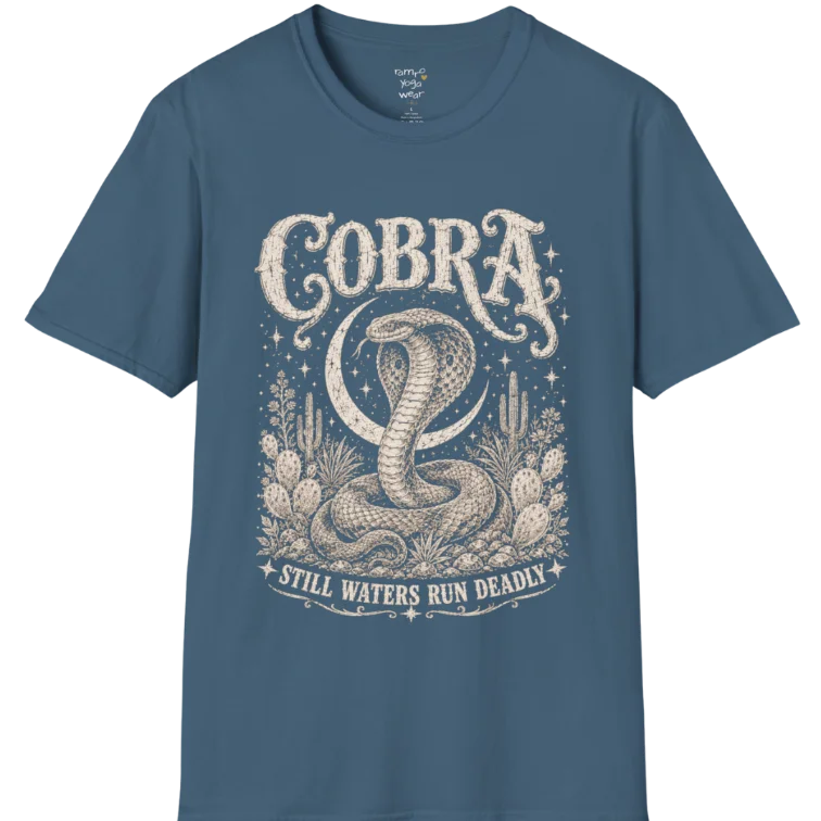 A grunge tee with an illustrated cobra design, hood flared, botanical linework framing the scene, text reading "Cobra" and "Still Waters Run Deadly" — Wild Animals collection by Ramro Yoga Wear in Indigo Blue.