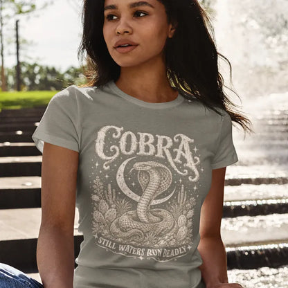 Person wearing the Cobra T-Shirt in Heather Military Green, standing outdoors near a set of steps — Wild Animals collection by Ramro Yoga Wear.