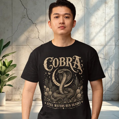 Person wearing the Cobra T-Shirt in Black, standing indoors near a weathered wall and greenery — Wild Animals collection by Ramro Yoga Wear.