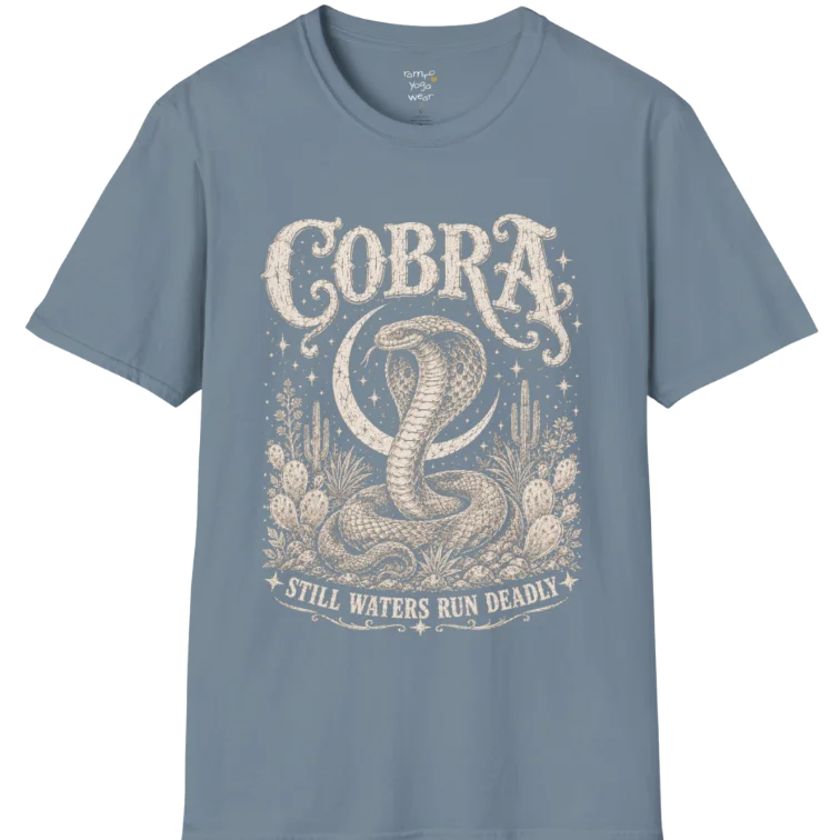 A grunge tee with an illustrated cobra design, hood flared, botanical linework framing the scene, text reading "Cobra" and "Still Waters Run Deadly" — Wild Animals collection by Ramro Yoga Wear in Stone Blue.