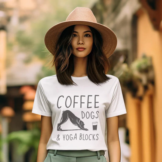 Woman wearing Coffee Dogs T-Shirt outdoors with casual yoga-inspired street style look.
