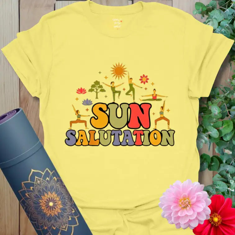 Cornsilk Sun Salutation T-Shirt with golden sunrise illustration and retro lettering. A bright yoga shirt inspired by early light and joy.