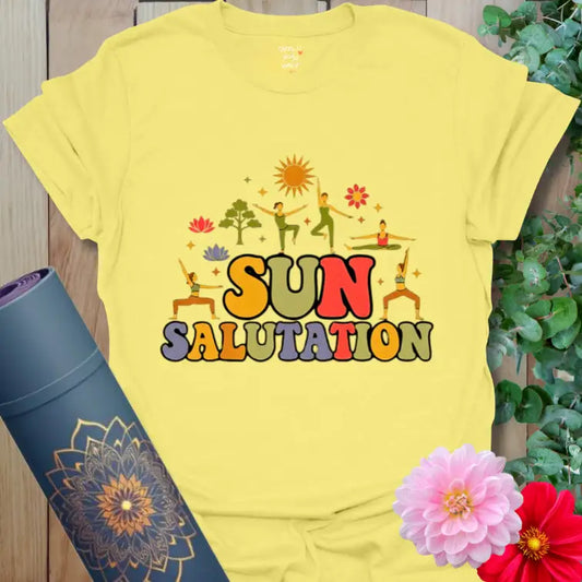 Cornsilk Sun Salutation T-Shirt with golden sunrise illustration and retro lettering. A bright yoga shirt inspired by early light and joy.