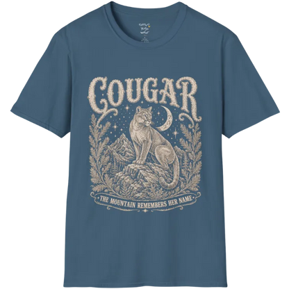 Cougar T-Shirt flat lay with a cougar perched on a mountain rock ledge beneath a crescent moon and pine framing — vintage engraved graphic tee by Ramro Yoga Wear in Indigo Blue.