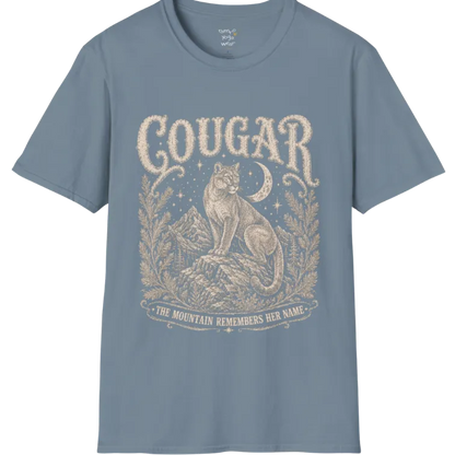 Cougar T-Shirt flat lay with a cougar perched on a mountain rock ledge beneath a crescent moon and pine framing — vintage engraved graphic tee by Ramro Yoga Wear in Stone Blue.