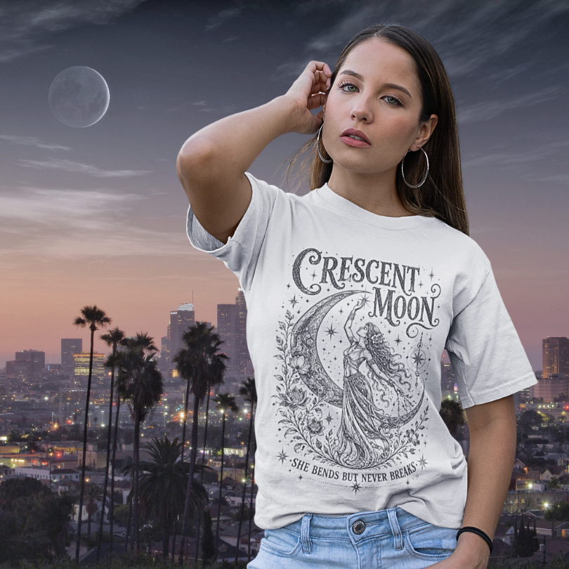 Woman wearing Crescent Moon white sacred yoga shirt at golden hour with city skyline and crescent moon — Sacred Thread collection by Ramro Yoga Wear