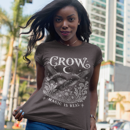Ramro Yoga Wear Crow tee — lifestyle shot, city palms, crow crescent moon botanical vintage engraving