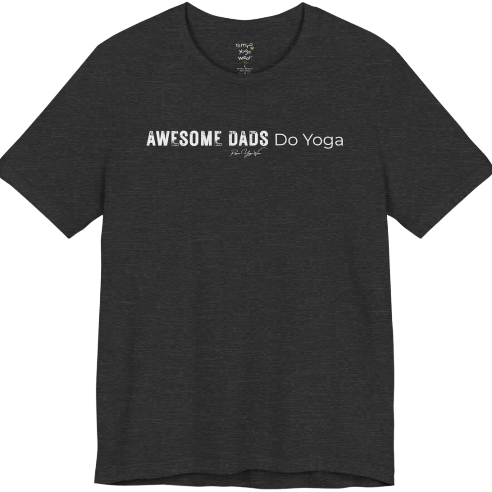 A short sleeved tee called the Dads T-Shirt, flat lay and a soft cotton blend shirt. Simply says, Awesome Dads Do Yoga. Design highlights bold distressed block lettering for Awesome Dads beside lighter thin lettering for Do Yoga, with a small script signature underneath. Color is Dark Heather Grey.