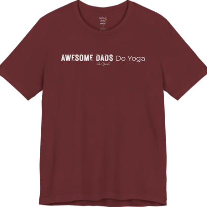 A short sleeved tee called the Dads T-Shirt, flat lay and a soft cotton blend shirt. Simply says, Awesome Dads Do Yoga. Design highlights bold distressed block lettering for Awesome Dads beside lighter thin lettering for Do Yoga, with a small script signature underneath. Color is Heather Cardinal.