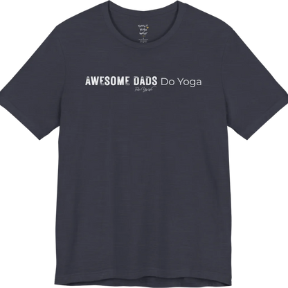 A short sleeved tee called the Dads T-Shirt, flat lay and a soft cotton blend shirt. Simply says, Awesome Dads Do Yoga. Design highlights bold distressed block lettering for Awesome Dads beside lighter thin lettering for Do Yoga, with a small script signature underneath. Color is Heather Midnight Navy.