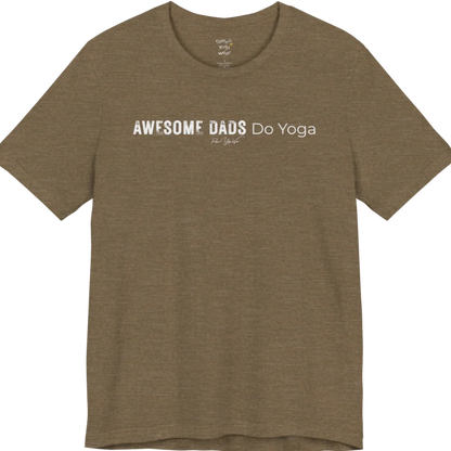 A short sleeved tee called the Dads T-Shirt, flat lay and a soft cotton blend shirt. Simply says, Awesome Dads Do Yoga. Design highlights bold distressed block lettering for Awesome Dads beside lighter thin lettering for Do Yoga, with a small script signature underneath. Color is Heather Olive.