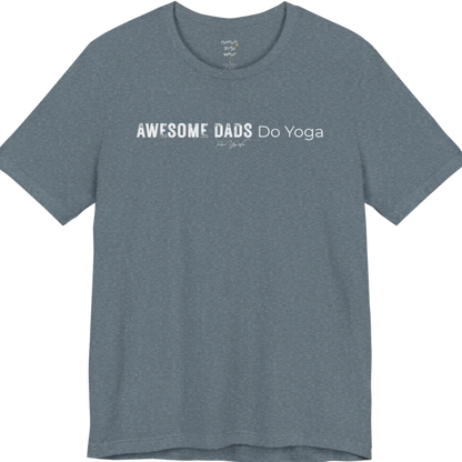 A short sleeved tee called the Dads T-Shirt, flat lay and a soft cotton blend shirt. Simply says, Awesome Dads Do Yoga. Design highlights bold distressed block lettering for Awesome Dads beside lighter thin lettering for Do Yoga, with a small script signature underneath. Color is Heather Slate.