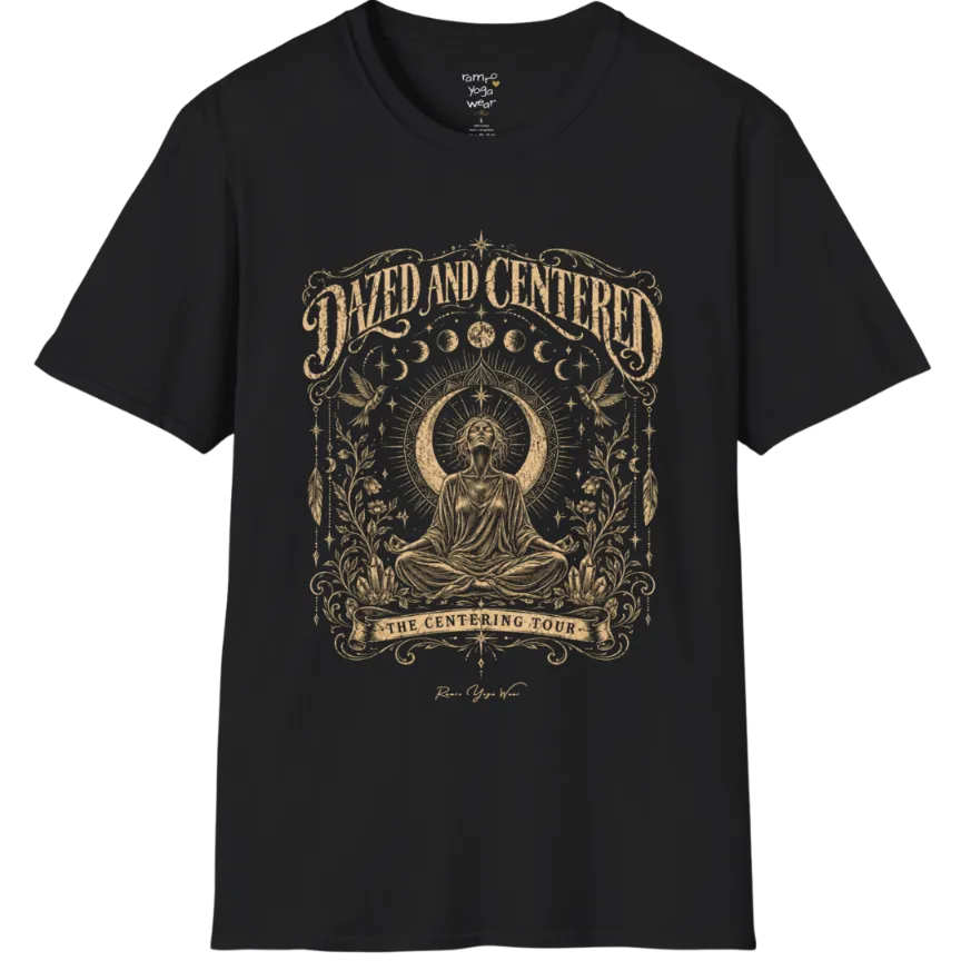 A short sleeved tee called the Dazed T-Shirt, flat lay and a soft cotton shirt. Simply says, Dazed and Centered, The Centering Tour. Design highlights a person meditating in lotus pose before a crescent moon with a mandala and radiating rays, framed by moon phases, songbirds, climbing vines, hanging feathers and crystals. Color is Black.