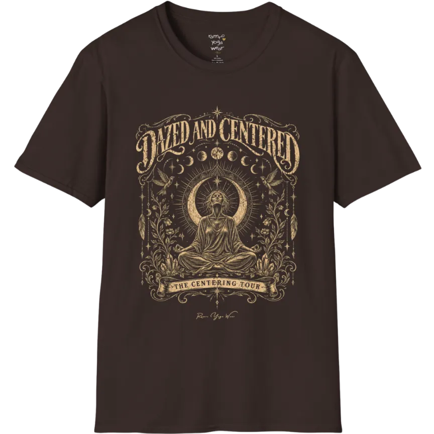 A short sleeved tee called the Dazed T-Shirt, flat lay and a soft cotton shirt. Simply says, Dazed and Centered, The Centering Tour. Design highlights a person meditating in lotus pose before a crescent moon with a mandala and radiating rays, framed by moon phases, songbirds, climbing vines, hanging feathers and crystals. Color is Dark Chocolate.