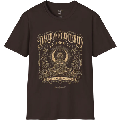 A short sleeved tee called the Dazed T-Shirt, flat lay and a soft cotton shirt. Simply says, Dazed and Centered, The Centering Tour. Design highlights a person meditating in lotus pose before a crescent moon with a mandala and radiating rays, framed by moon phases, songbirds, climbing vines, hanging feathers and crystals. Color is Dark Chocolate.