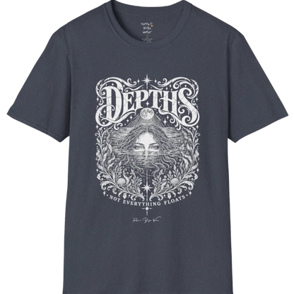 Short sleeved tee, illustration of a  woman submerged to the eyes in water, hair flowing into seaweed and shells, a full moon above her and stars scattered throughout, framed by ornate botanical linework. Depths T-Shirt flat lay is a Gildan 64000 and the color is Heather Navy.