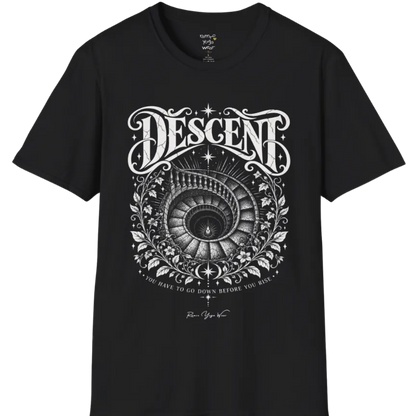 Spiral staircase descending into darkness with a single small light glowing at the bottom, fine botanical framing around the stairwell. Descent T-Shirt flat lay is a short sleeved tee, Gildan 64000 and the color is Black.