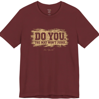 A short sleeved grunge tee, smudged  paint background with bold typography reading "Do You. The Mat Won't Judge." — Funny Yoga Shirts collection by Ramro Yoga Wear in Heather Cardinal