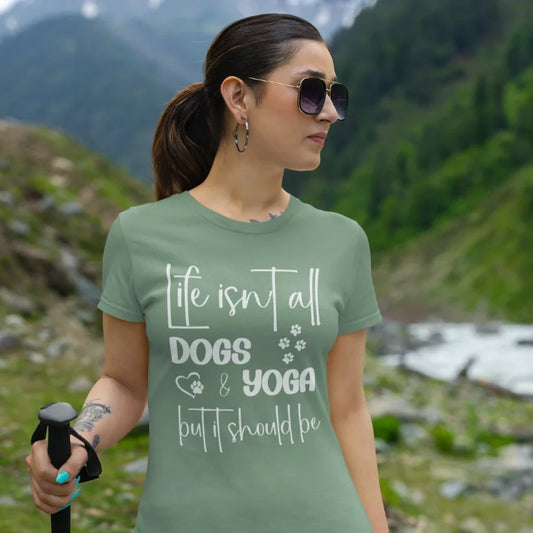 Dog T-Shirt worn outdoors on scenic trail with relaxed model and mountain backdrop. Yoga dog tee styled for movement, nature, and everyday comfort.