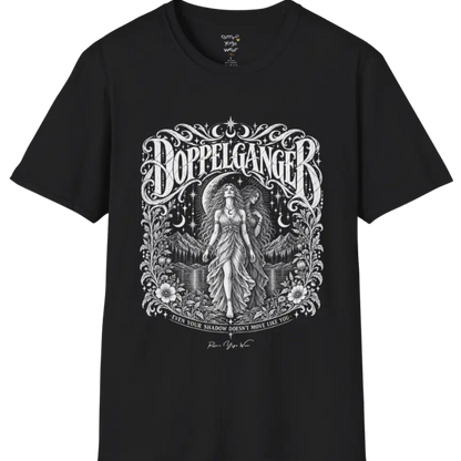 A short sleeved tee called the Doppelganger T-Shirt, flat lay and a Gildan 64000 shirt. Simply says, Even Your Shadow Doesn't Move Like You. Design highlights a woman standing before a crescent moon with a second shadow-self figure behind her, framed by mountains, florals, and ornate engraved linework border. Color is Black.
