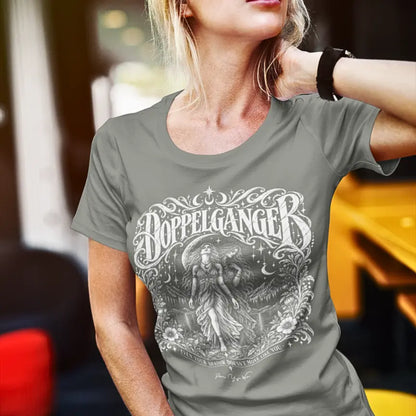 Person wearing the Doppelganger T-Shirt, Even Your Shadow Doesn't Move Like You design, outdoors in natural light, in Heather Military Green.