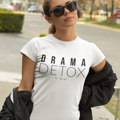 "Drama Detox" stacked sans-serif text design — The Vault collection by Ramro Yoga Wear, in White. Model walking down a Californian street.