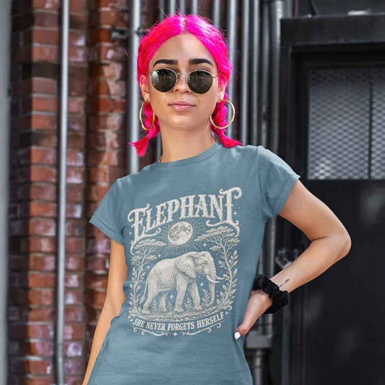 Person wearing the Elephant T-Shirt in Stone Blue, standing outdoors against a brick wall — Wild Animals collection by Ramro Yoga Wear.