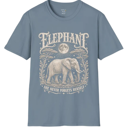A grunge tee with an illustrated elephant beneath a crescent moon, botanical linework framing the scene, text reading "Elephant" and "She Never Forgets Herself" — Wild Animals collection by Ramro Yoga Wear in Stone Blue