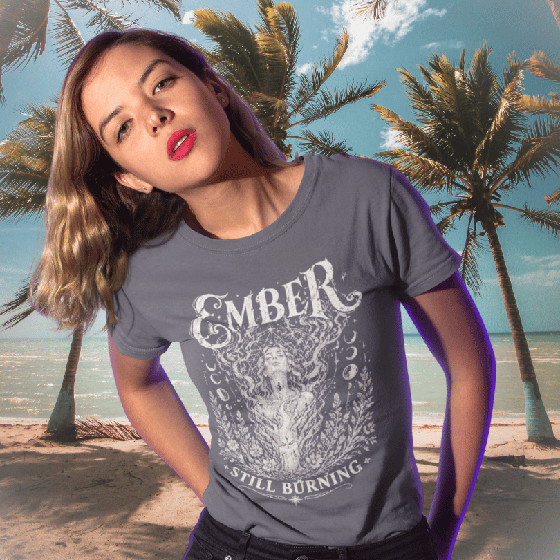Ramro Yoga Wear Ember tee in Dark Heather Grey — still burning ember flame design, tropical beach palm trees lifestyle shot