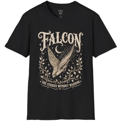 A grunge tee with an illustrated falcon wing design, crescent moon, and botanical linework, text reading "Falcon" and "She Strikes Without Warning" — Wild Animals collection by Ramro Yoga Wear in Black.