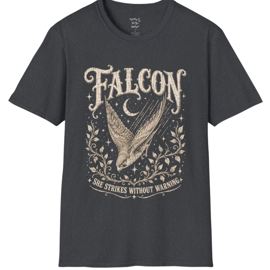 A grunge tee with an illustrated falcon wing design, crescent moon, and botanical linework, text reading "Falcon" and "She Strikes Without Warning" — Wild Animals collection by Ramro Yoga Wear in Dark Heather Grey.