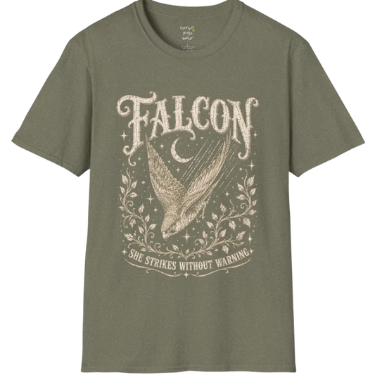 A grunge tee with an illustrated falcon wing design, crescent moon, and botanical linework, text reading "Falcon" and "She Strikes Without Warning" — Wild Animals collection by Ramro Yoga Wear in Heather Military Green.
