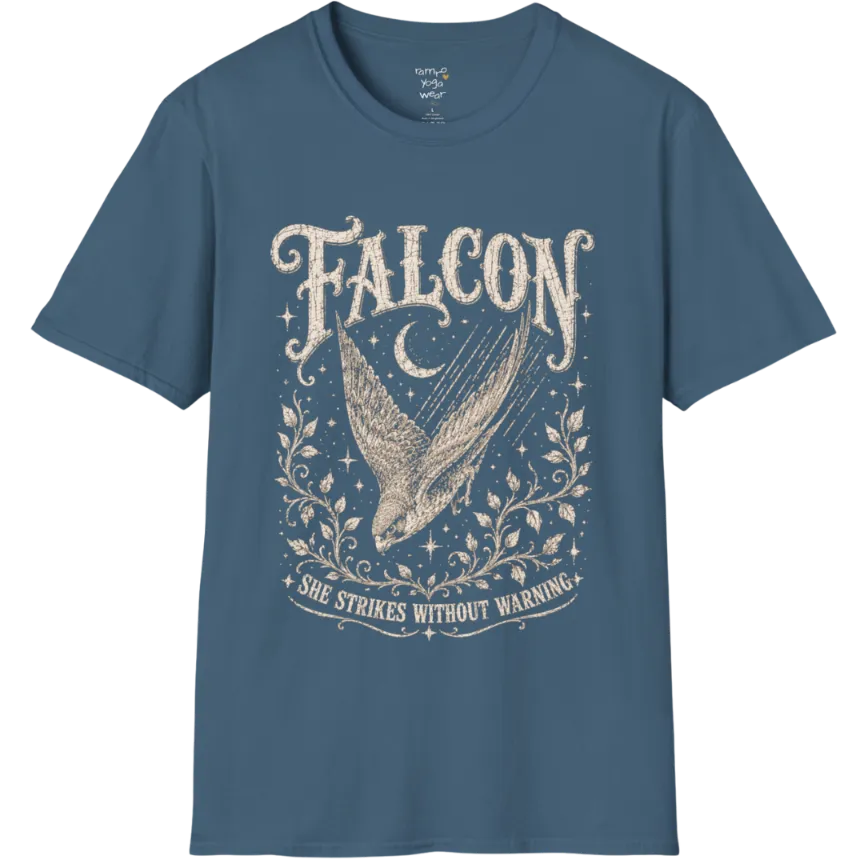 A grunge tee with an illustrated falcon wing design, crescent moon, and botanical linework, text reading "Falcon" and "She Strikes Without Warning" — Wild Animals collection by Ramro Yoga Wear in Indigo Blue